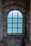 Lake ​​view through the window of a medieval castle